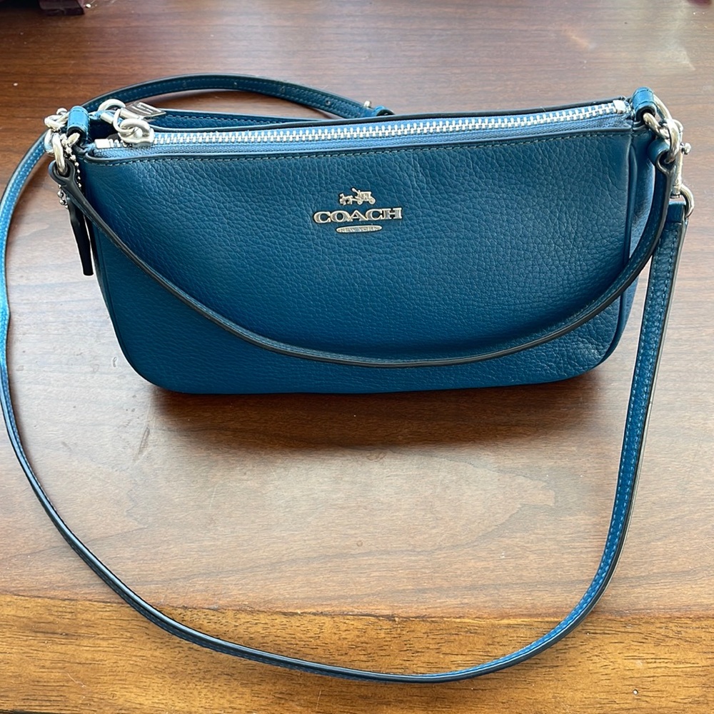 Pretty blue Coach bag with silver hardware.